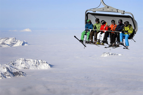 A[-]group[-]of[-]skiers[-]rode[-]up[-]a[-]mountain[-]above[-]a[-]blanket[-]of[-]fog[-]on[-]a[-]cable[-]car[-]in[-]Engelberg,[-]Switzerland,[-]Dec.[-]1.[-]Fabrice[-]Coffrini/Agence[-]France-Presse