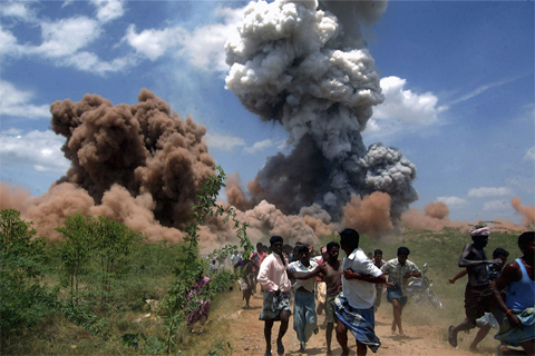 People[-]ran[-]for[-]cover[-]as[-]smoke[-]rose[-]from[-]a[-]fireworks[-]factory[-]on[-]the[-]outskirts[-]of[-]Sivakasi,[-]India,[-]Sept.[-]5.[-]Some[-]40[-]people[-]were[-]killed[-]and[-]60[-]injured[-]when[-]a[-]fire[-]set[-]off[-]hundreds[-]of[-]fireworks,[-]officials[-]said.[-]Human[-]Toll[-]of[-]India’s[-]Firework[-]Business[-]Associated[-]Press